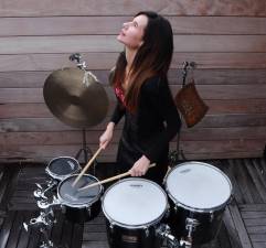 Lisa Pegher got her first drum set when she was seven and a teacher recognized her talent and paid for the drum set as well as a year of lessons.