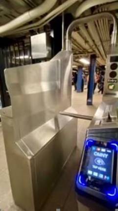 A new fare-evasion prevention tweak on low-lying turnstiles is some sheet metal on the side to prevent evaders from jumping over the turnstile. While neither high-tech nor new, NYC Transit hopes simple measure should increase properly collected subway fares. Photo: Ray Raimundi/MTA