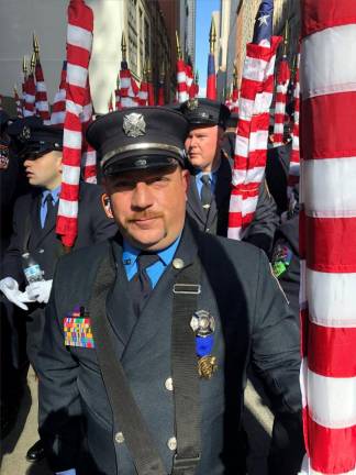 <b>Thomas Smith was a volunteer fireman when his father, Kevin Smith a firefighter in Hazmat Squad 288 was killed on 9/11. He was one of the 343 flagbearers for the FDNY at the St. Patrick’s Day parade.</b> Photo: Keith J. Kelly