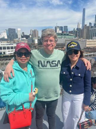 Mark Baraket (middle) is a science teacher and three-time eclipse viewer. He said that an eclipse-viewing trip to the Intrepid was going to be turned into a “report” for his students.