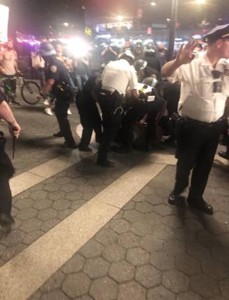 <b>Police surround a protestor at Union Sq. as they move to shut down a protest on May 30, 2020</b>.