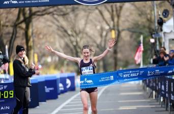 Karoline Bjerkel Grovdal, 33,of Norway break the tape to win women’s race at the NYC Half Marathon on March 17 with a time of 1:09:09 averaging 5:17 per mile. Photo: NY Roadrunners