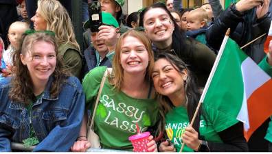 <b>Caitlan, Anna and Nicole, originally from Tennessee but now students at Fordham, were taking in the St. Patrick’s Day parade for the first time.</b> Photo: Keith J. Kelly