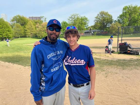 Peter Reyes, the assistant coach of the Chelsea Lions, pictured with Jasper Caruso on May 3. Caruso pitched a perfect game on April 18, but he’s not letting it get to head in the final weeks of his team’s regular season.