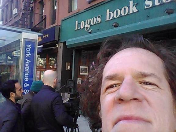 Peter Pereira in front of Logos Book Store. Photo courtesy of Karina Holosko