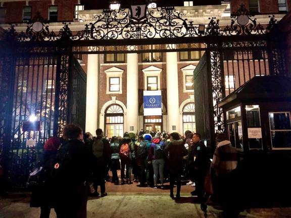 Students gather to pay respects to Tessa Majors at the Barnard College main gate on Thursday night.