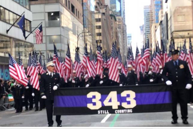 <b>The FDNY marches behind a banner reading “343 Still Counting” to commemorate those firefighters who died on 9/11 and those who continue to die from 9/11 linked illnesses</b>. Photo: Keith J. Kelly