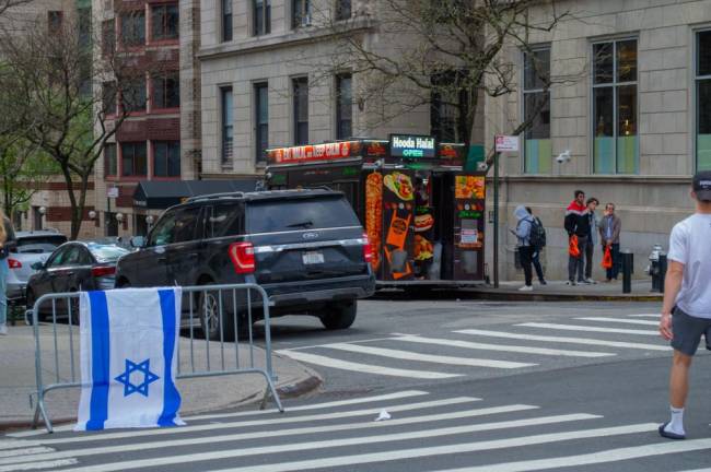 An Israeli flag hangs on a fence near Columbia. (Photo: Andrew McDonald).