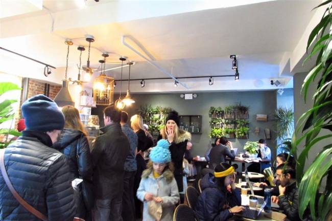 Customers crowd the PlantShed cafe on Columbus Ave. and 87th St.