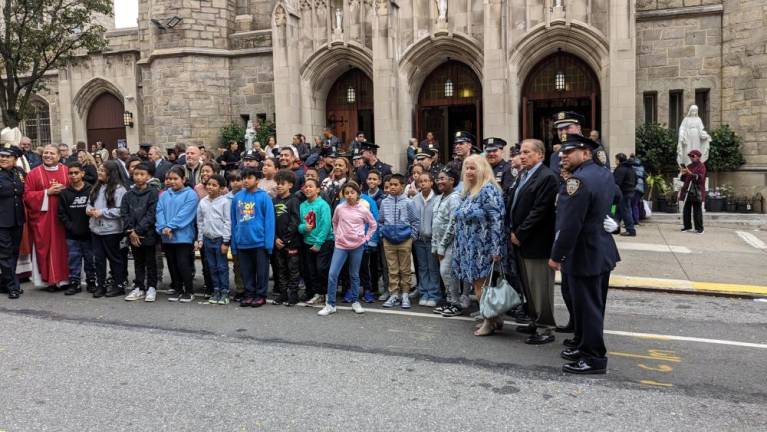 Local school kids turn out for the memorial every year, drawn from the nearby St. Elizabeth’s School and Michael Buczek Elementary, P.S. 48, on the corner of Broadway and 184th St. Photo: Brian Berger