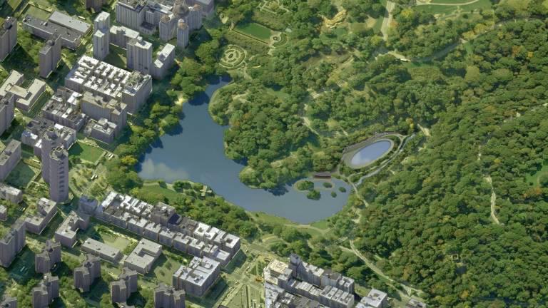 An aerial view of the reinvented north end of Central Park with Fifth Avenue at left and Central Park North at bottom. The Harlem Meer is at center and the new oval-shaped Lasker pool and skating rink is at center-right.