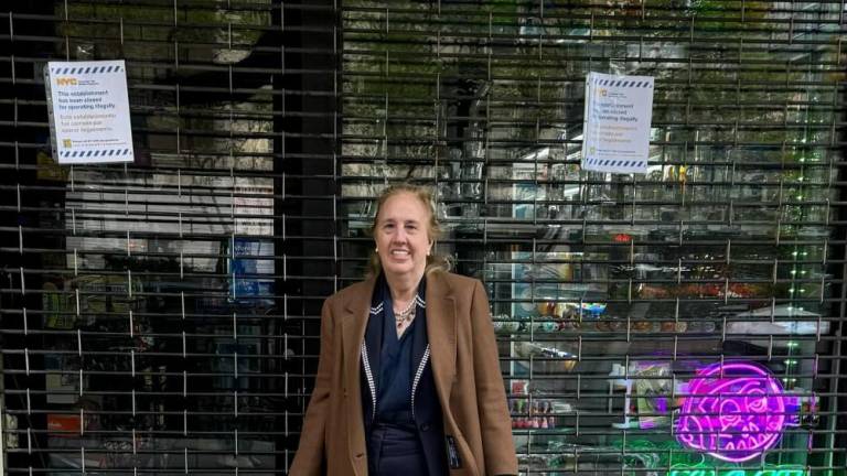 Council Member Brewer outside a padlocked illegal weed shop, April 2024.