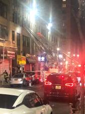 <b>Fire erupted on the third floor of an unoccupied commercial building one block north of MSG on W. 35th St. on April 14th</b>. Photo: Keith J. Kelly