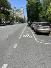 Markings on street where protected bike lane would be established north of 77th Street.