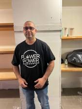 Angelo Kitkas puts the finishing touches on a space that will house Flower Power Dispensers, the first licensed adult-use cannabis store on the UWS.