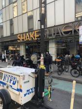 The scene at the Shake Shake where right outside its doors on Feb. 9, a 22 year old man was shot and killed . Police are seeking two suspects fled south down Eighth Ave and then west on 43rd St. Photo: Keith J. Kelly