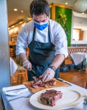 Chef Hakan Akbar at Tudor City Steakhouse. Photo courtesy of Tudor City Steakhouse