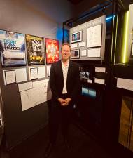 David Korins stands before the <i>Dear Evan Hansen</i> portion of an exhibit on his many set designs being featured at the Museum of Broadway now through September.