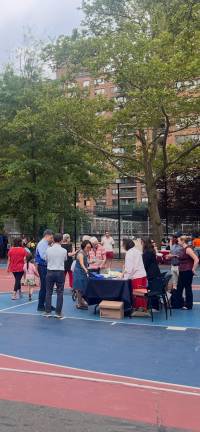 Attendees chatting with family court representatives, who had set up a table.