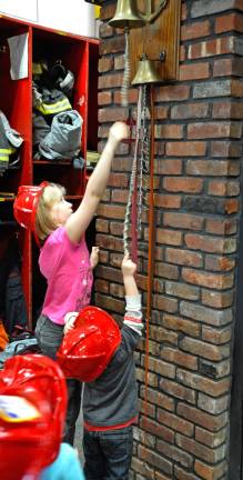Ringing the firehouse bell. Photo by Veronica Bruno