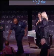A security guard rushing to grab Chad Michael Busto (bottom left, red shirt) at the 92Y on August 21, after he attempted to reach Drew Barrymore (second from right) while claiming he “needed” to see her.