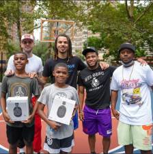 Andrew Blacks (far right) and Cole Anthony of the Orlando Magic (back row, second from left) at Positive Influence Basketball. Photo courtesy of Andrew Blacks