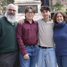 Rabbi Stephanie Ruskay (right), husband Darren (left) and their two sons.