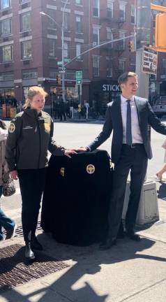 NYC Sanitation Commissioner Jessica Tisch (left) and City Council Member Erik Bottcher preparing to unveil a new–and hopefully rat-proof–trash can on the corner of 9th Ave. &amp; 43rd St., which is within Bottcher’s Hell’s Kitchen district.