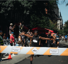 Akinola Raymond wins the 100 meter dash and earns $4,000 in a “Who Runs NYC” race staged by Nike in which it said the winner