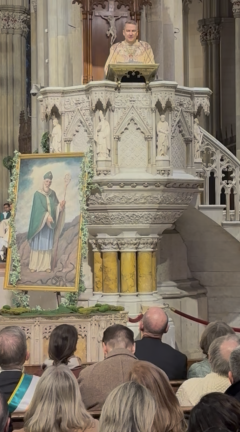 The cathedral is filled to capacity as Archbishop Ronald Hicks delivers his first St. Patrick’s Day sermon, in which he urged Irish-Americans to extend a hand to new arrivals.