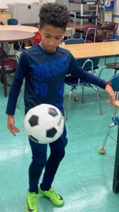 Fourth grader Reis Powell showing off his soccer skills. Photo courtesy of Neil Fitzgerald, Arts and Athletics