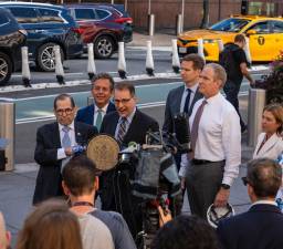 MTA Chairman Janno Lieber (white shirt) seems to be snapping to attention as he listens to a press conference with (from left) Congressman Gerald Nadler, Assemblyman Tony Simone, Manhattan Borough President Mark Levine and City Council Member Erik Bottcher on how to reconfigure Penn Station. CB5 board member Layla Law-Gisiko (far right) listens in as well. Photo: Office of the Manhattan Borough President