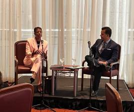 Surprise statement: City Council Speaker Adrienne Adams (left) said at a Citizens Union breakfast (with moderator John Avlon) that outdoor dining should be confined to sidewalks. Photo via Adrienne Adams on Twitter