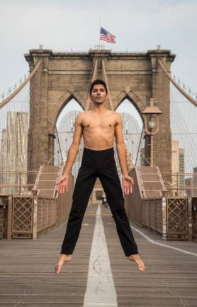 Glauco Araujo dancing on the Brooklyn Bridge. Photo: Joshua Ramos