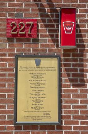 Plaque in front of FDNY Engine 24/Ladder 5/Battalion 2 Firehouse honoring fallen firefighters during 9/11.