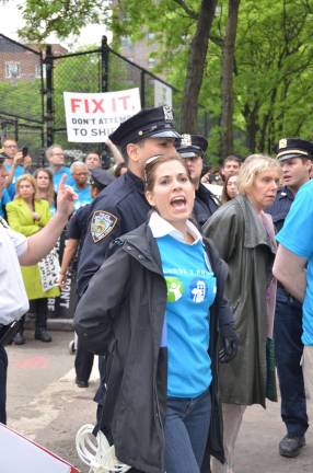 Pledge 2 Protect president Kelly Nimmo-Guenther being led away in handcuffs after a civil disobedience demonstration last year against the East 91st Street marine transfer station. Pledge 2 Protect is the most high-profile group dedicated to preventing the MTS from becoming operational.