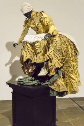 Mary Sibande's &quot;Rubber Soul, Monument of Aspiration&quot; from The Met Breuer's &quot;Like Life.&quot; Sibande's work refers to the history of apartheid, said curator Sheena Wagstaff, but also to &quot;the history of artists from that region ascending and taking over the plinth.&quot; Photo: Adel Gorgy