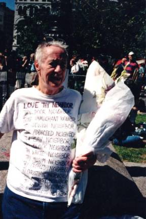 Keith Crandell wearing T-shirt with text composed by him and Annie Shaver-Crandell.
