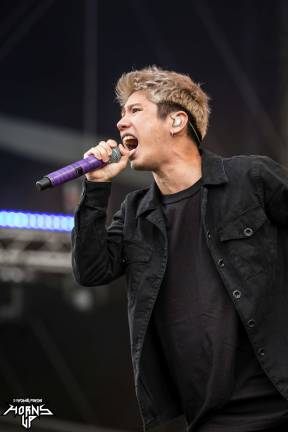 One Ok Rock&#x2019;s Takahiro Moriuchi performing at Download Festival in Paris, France in 2016. Photo: mzagerp, via flickr