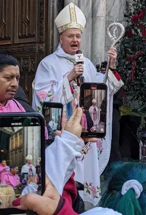 Bishop Edmund Whalen greeting parisioners outside St. Patrick’s for the Feast of Our Lady of Guadalupe., Dec. 12, 2023.