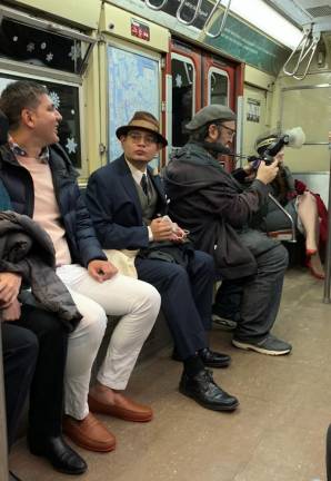 Riding on one of the 1960s-era subway cars, riders, models and serious enthusiasts come together to share in the sounds, visual stimulation and smells of a bygone era. Photo: Ralph Spielman