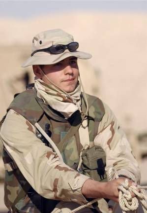 Marine PFC Aaron Clark at Camp Coyote, Iraq, Feb. 16, 2003, during Operation Enduring Freedom.