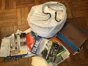 One of the many trash bags and piles of old college brochures that were thown out.