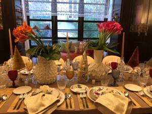 A festively-appointed dining room table setting at Holiday House.