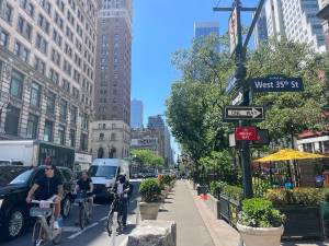 The Sixth Avenue bike lane, which the Mamdani Administration is set to widen, is currently one of the busiest in the city, with many New Yorkers and visitors utilizing the lane each day. (Photo: Jacqueline Gordon)