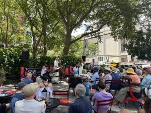Farmer energizes the crowd in Dante Park.