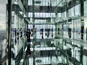 The main gallery, Air, makes for interesting perceptions, between all the mirrored surfaces, and four of the five New York City boroughs at your feet. Designed by Kenzo Digital. Photo: Ralph Spielman