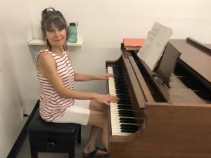 Colleen Jones at the piano at Ballet Academy East. Photo courtesy of Lea Efran