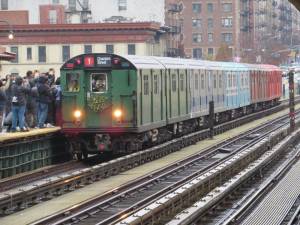 At the West 125th Street/Broadway Station, the Train of Many Colors, heading towards Chambers Street, stops to pick up passengers on November 27,2022. Photo: Ralph Spielman