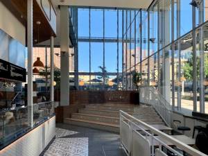 The Market’s Food Hall is filled with space and light; dining tables and chairs are to the right. Tapas bar Oliva, towards the rear, the newest addition to the space, opened at the end of September. Photo: Ralph Spielman